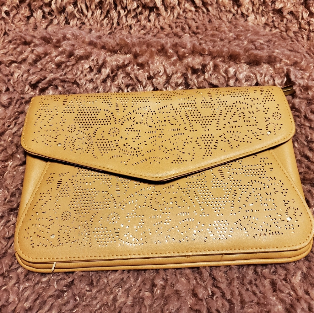 Lazer cut nude convertible clutch to long chain purse.
